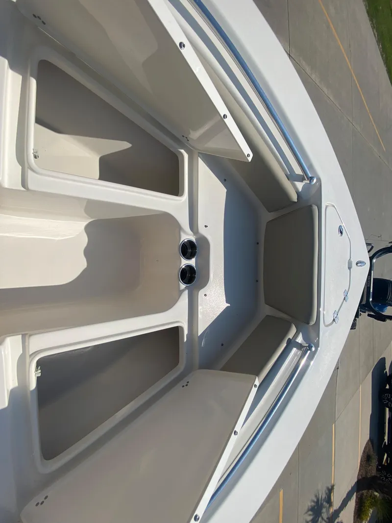 Slide: The Image of 2024 Key West 219 FS boat interior, bow storage compartments. - 23