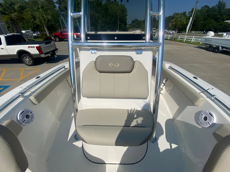 Slide: The Image of 2024 Key West 219 FS boat interior with seating and speakers. - 24