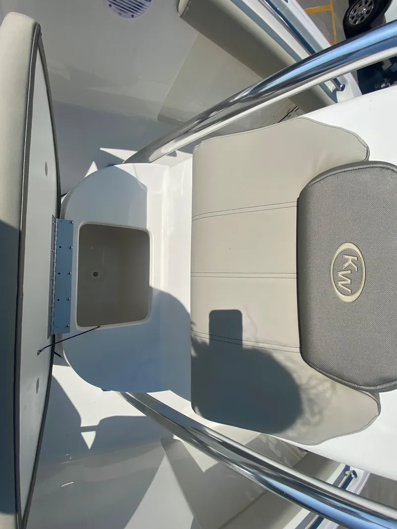 Slide: The Image of 2024 Key West 219 FS boat seat and storage compartment. - 25