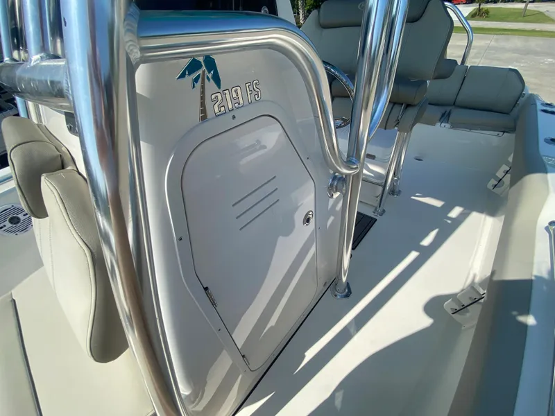 Slide: The Image of 2024 Key West 219 FS boat interior with seating and storage compartment. - 27