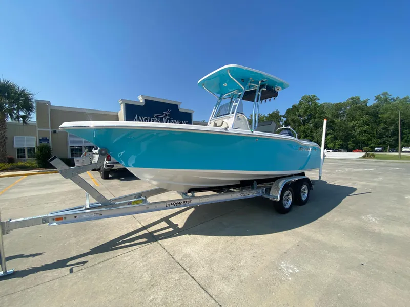 Slide: The Image of 2024 Key West 219 FS boat on trailer in dealership lot. - 3