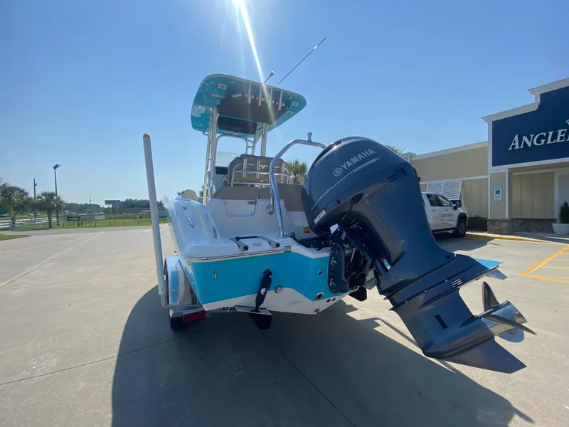 Slide: The Image of 2024 Key West 219 FS boat with Yamaha outboard motor in parking lot. - 5