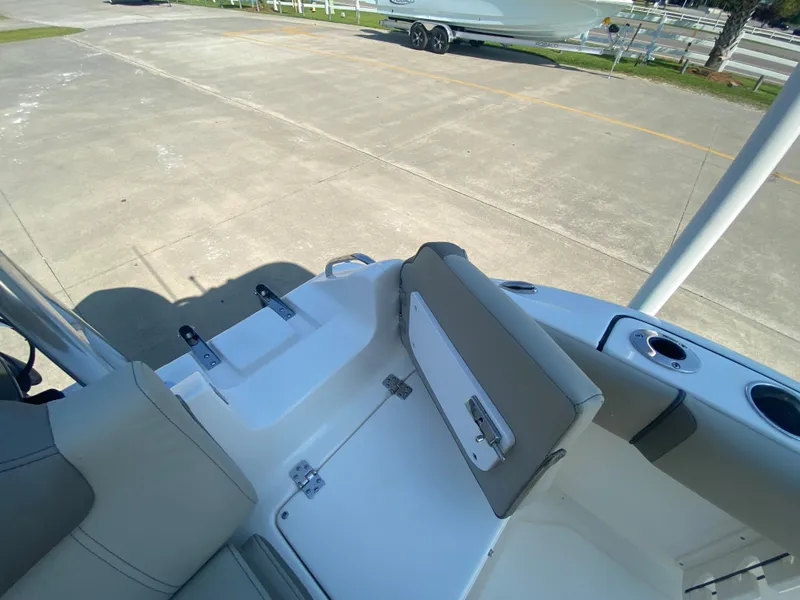 Slide: The Image of 2024 Key West 219 FS boat interior with seating and storage compartments. - 9