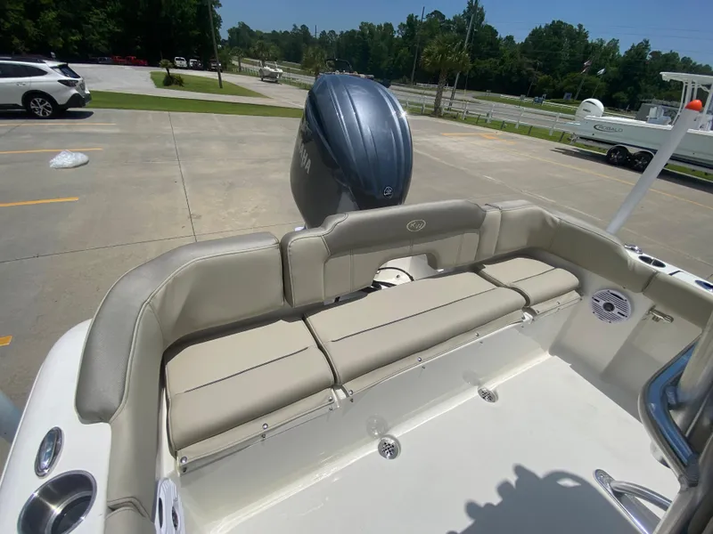 Slide: The Image of 2024 Key West 203 FS boat with rear seating and outboard motor. - 11