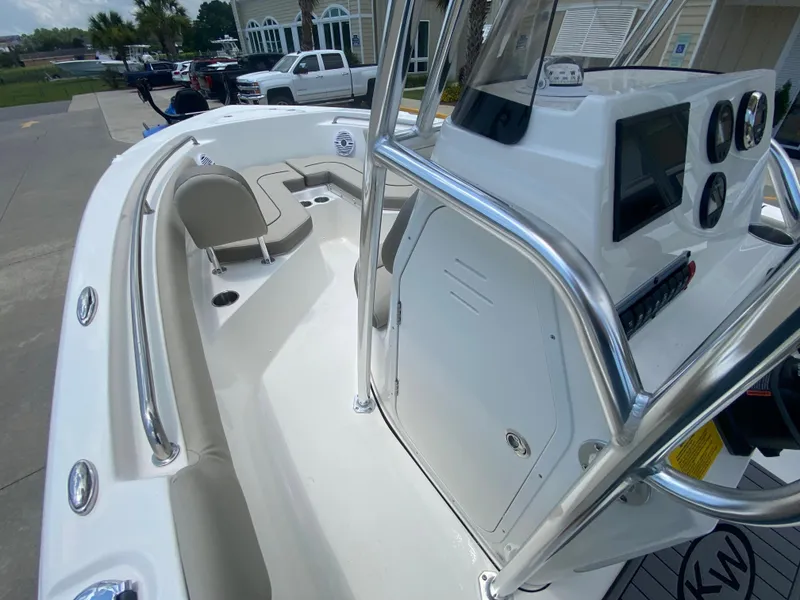 Slide: The Image of 2024 Key West 203 FS boat interior with console and seating. - 13
