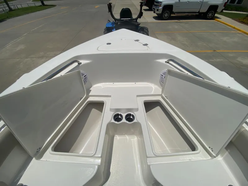 Slide: The Image of 2024 Key West 203 FS boat with open storage compartments. - 22