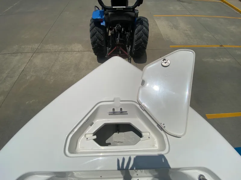 Slide: The Image of 2024 Key West 203 FS boat bow storage compartment with open hatch. - 23