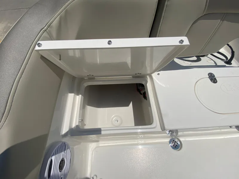 Slide: The Image of 2024 Key West 203 FS boat storage compartment and seating area. - 10