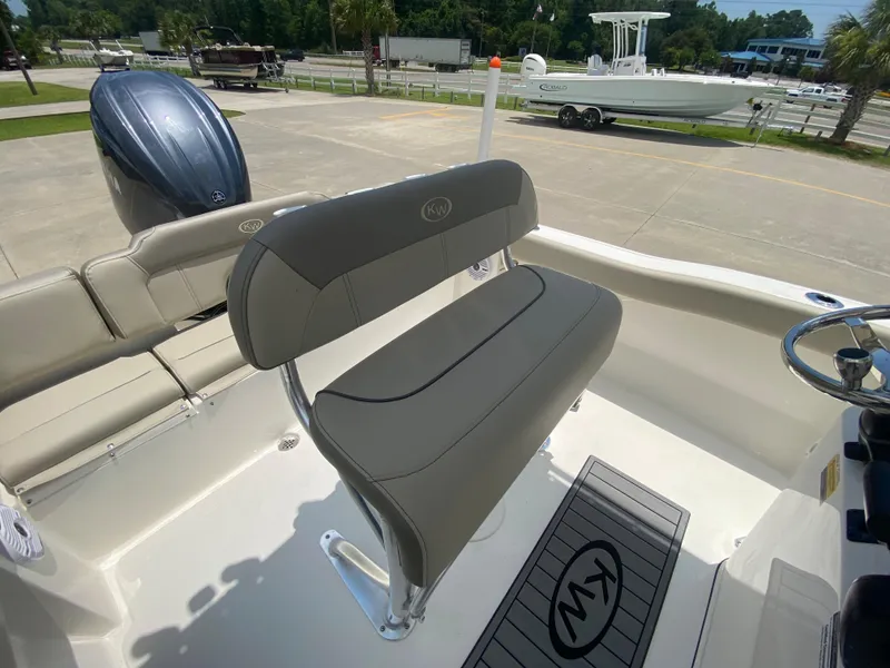 Slide: The Image of 2024 Key West 203 FS boat interior with seating and steering console. - 16