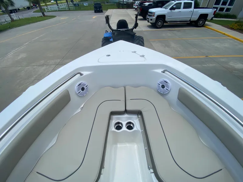 Slide: The Image of 2024 Key West 203 FS boat bow seating area with speakers and cup holders. - 20
