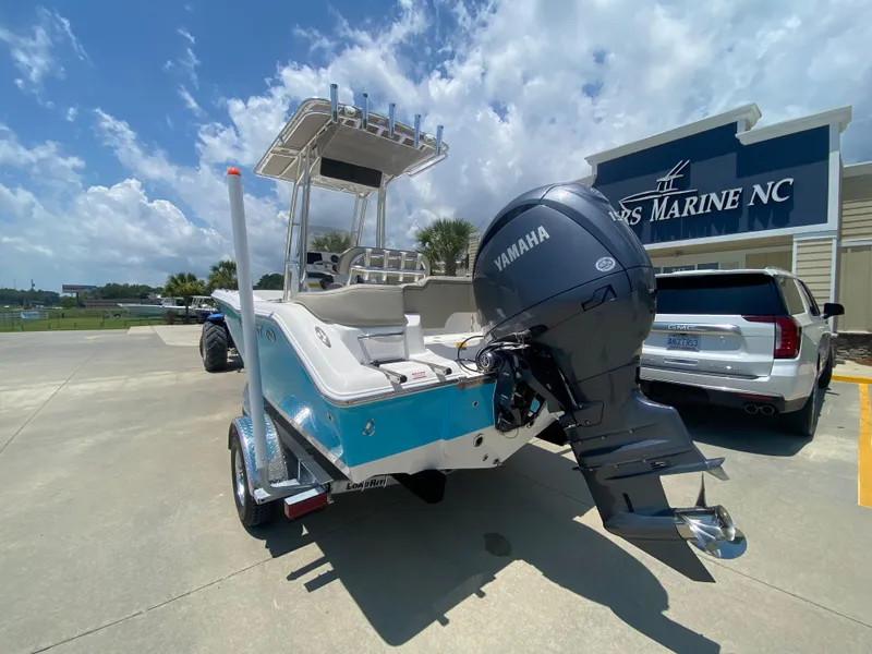 Slide: The Image of 2024 Key West 203 FS boat with Yamaha engine at a dealership. - 5