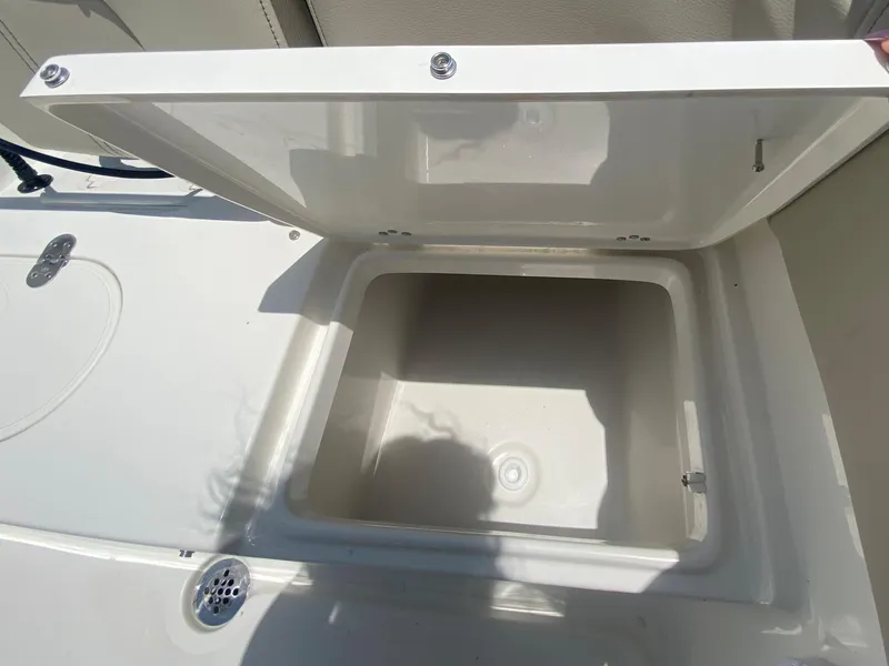 Slide: The Image of Open storage compartment on a 2024 Key West 203 FS boat. - 7