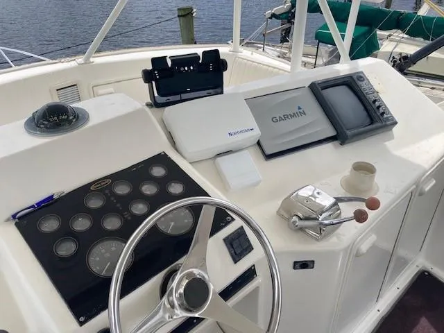 Slide: The Image of 1998 Ocean Yachts 45 Super Sport helm with Garmin navigation system and control panel. - 2
