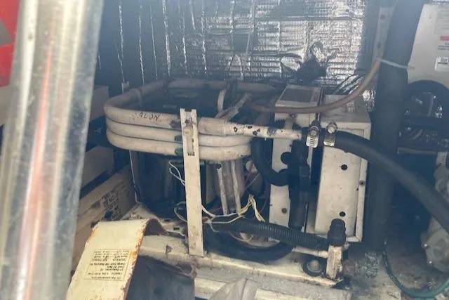 Slide: The Image of Engine room of a 1998 Ocean Yachts 45 Super Sport with mechanical equipment. - 26