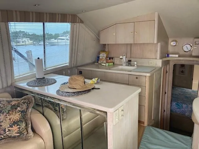 Slide: The Image of Interior of 1998 Ocean Yachts 45 Super Sport with kitchen and seating area. - 5