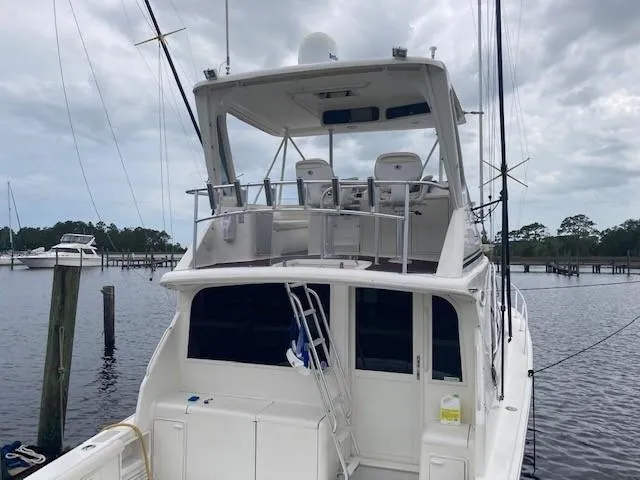 Slide: The Image of 1998 Ocean Yachts 45 Super Sport docked at a marina. - 1