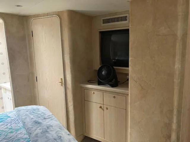 Slide: The Image of Interior cabin of a 1998 Ocean Yachts 45 Super Sport with TV and fan. - 11
