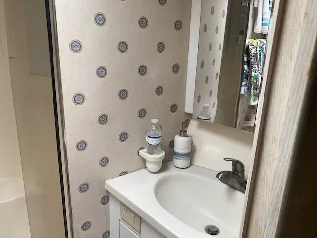 Slide: The Image of Bathroom sink area on a 1998 Ocean Yachts 45 Super Sport. - 15