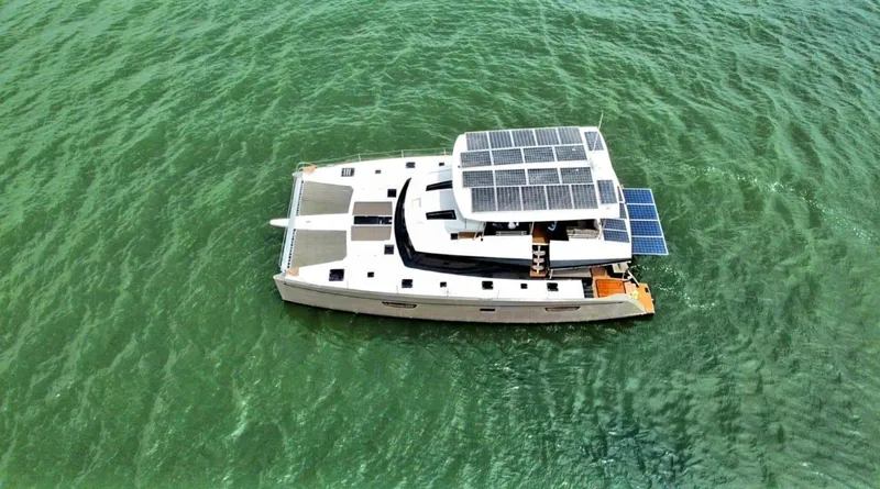 Slide: The Image of 2017 Fountaine Pajot Ipanema 58 Power Catamaran with solar panels on the water. - 0