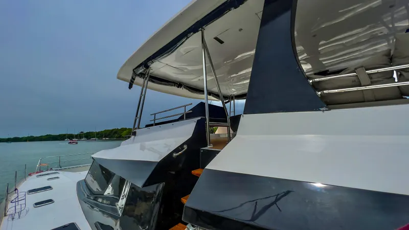 Slide: The Image of 2017 Fountaine Pajot Ipanema 58 Power Catamaran docked near the shore. - 34