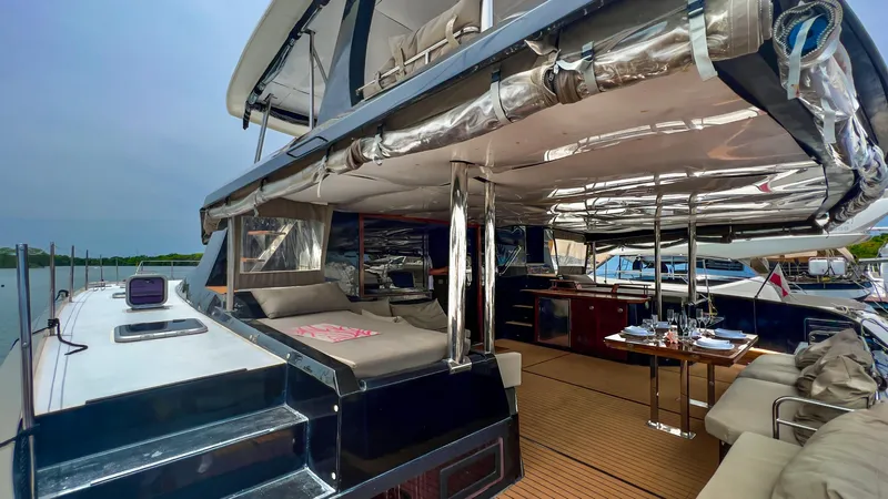 Slide: The Image of 2017 Fountaine Pajot Ipanema 58 Power Catamaran, spacious deck with seating and dining area. - 38