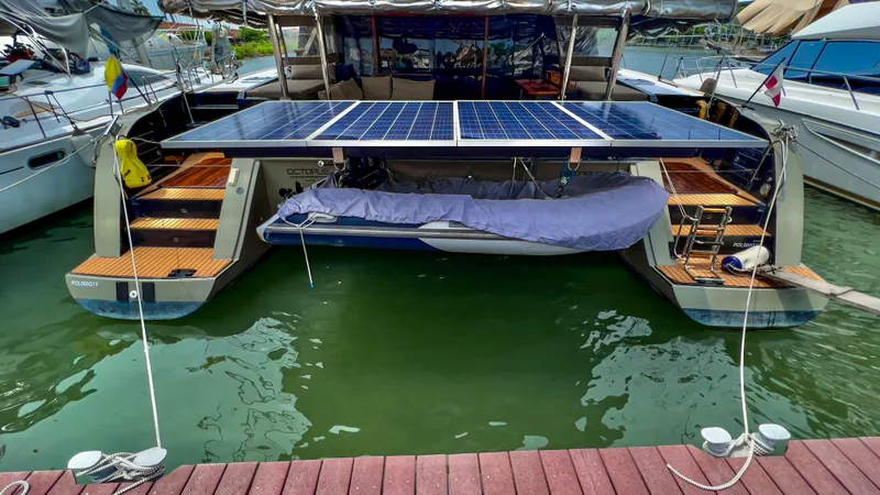 Slide: The Image of 2017 Fountaine Pajot Ipanema 58 Power Catamaran with solar panels docked at marina. - 9