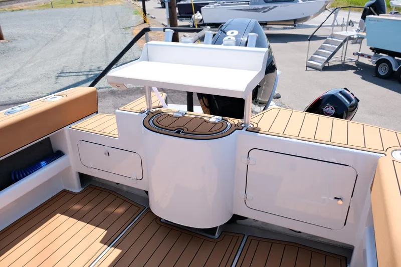 Slide: The Image of 2023 Makaira Gen3 800 boat deck with storage compartments and seating. - 11