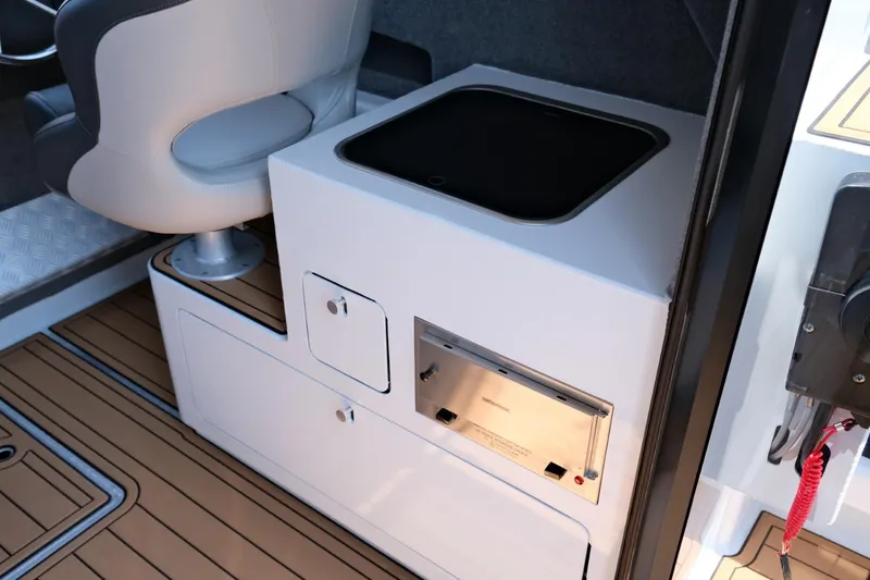 Slide: The Image of Makaira Gen3 800 boat interior, featuring a modern kitchenette and seating, 2023 model. - 17