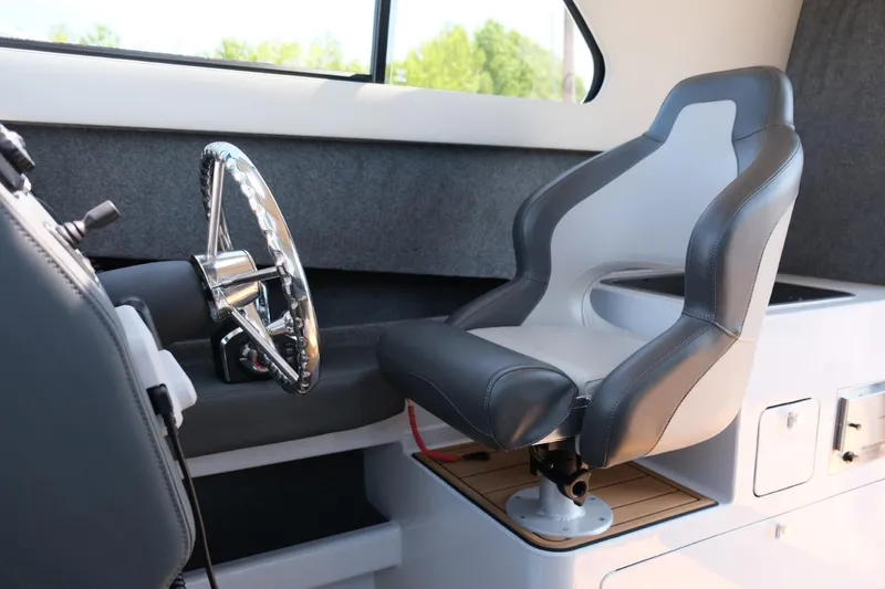Slide: The Image of Makaira Gen3 800 boat interior, featuring a modern captain's chair and steering wheel, 2023 model. - 20