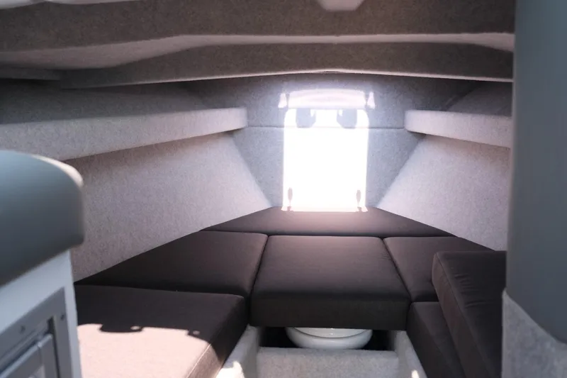 Slide: The Image of Interior cabin of 2023 Makaira Gen3 800 boat with cushioned seating. - 23