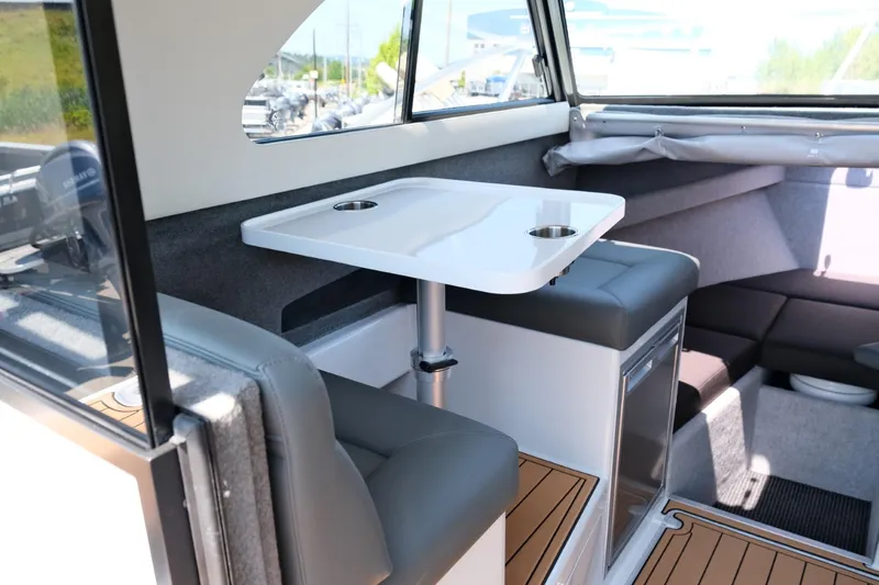 Slide: The Image of Interior of 2023 Makaira Gen3 800 boat with seating and table. - 28