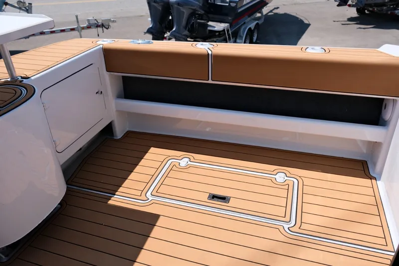 Slide: The Image of Makaira Gen3 800 boat deck, 2023 model, featuring teak flooring and cushioned seating. - 32