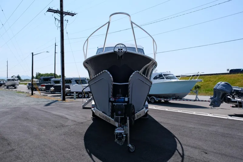 Slide: The Image of 2023 Makaira Gen3 800 boat on trailer, parked outdoors. - 4