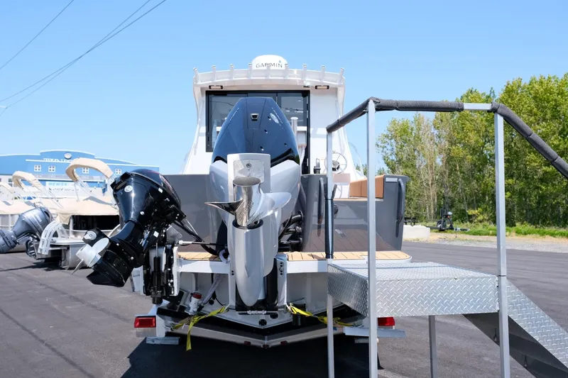 Slide: The Image of 2023 Makaira Gen3 800 boat with dual outboard motors on display. - 5