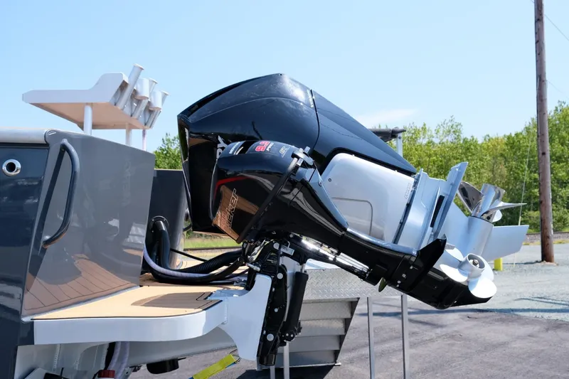 Slide: The Image of 2023 Makaira Gen3 800 outboard motor on a boat, docked outdoors. - 7
