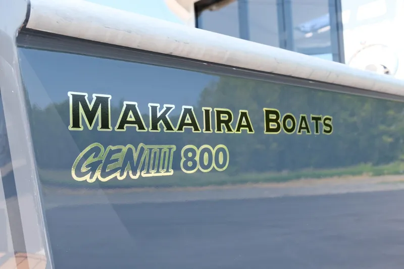 Slide: The Image of Makaira Gen3 800 boat logo, 2023 model, displayed on a sleek surface. - 9