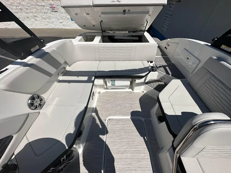 Slide: The Image of 2024 Sea Ray SPX 230 boat interior with spacious seating and modern design. - 18
