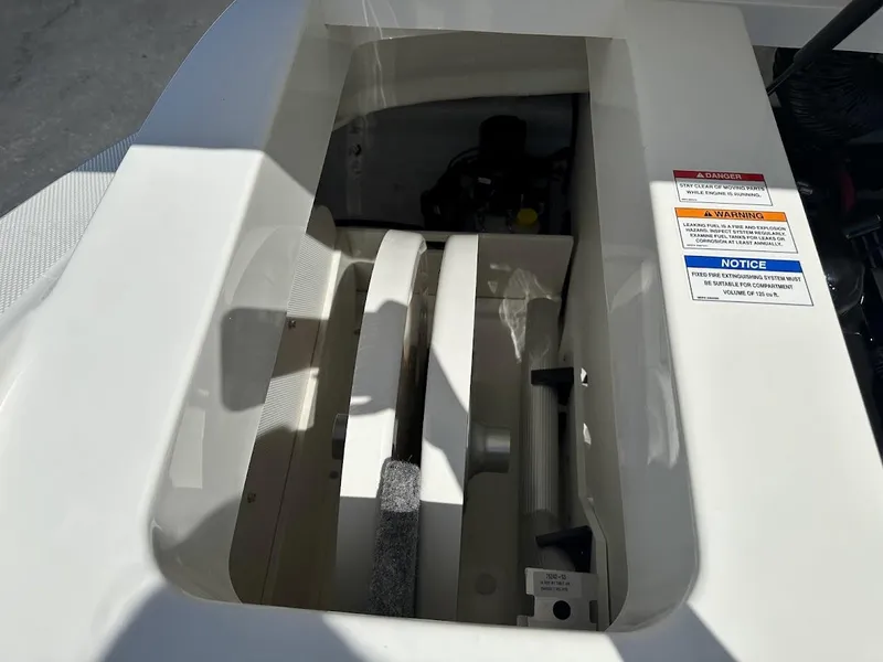 Slide: The Image of Engine compartment of a 2024 Sea Ray SPX 230 boat. - 22