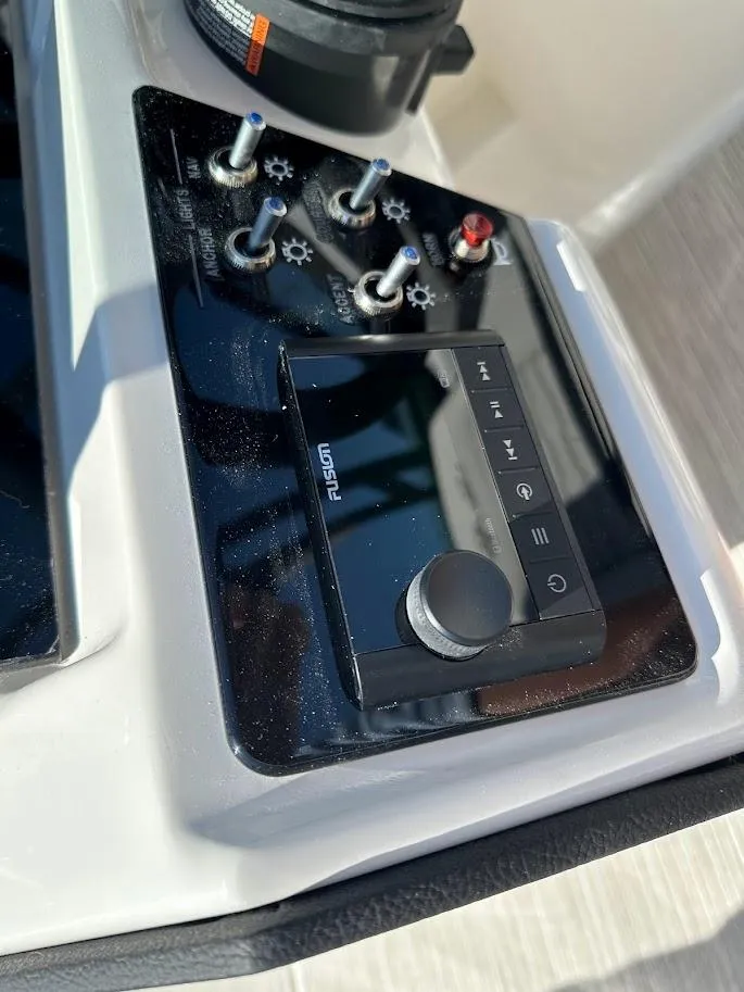 Slide: The Image of Control panel of 2024 Sea Ray SPX 230 boat with Fusion audio system. - 25