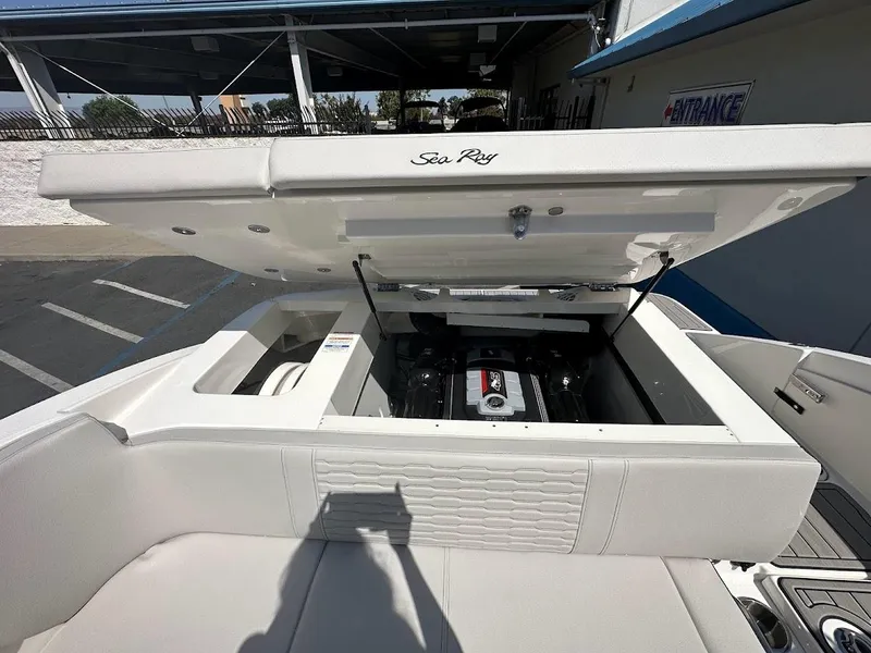 Slide: The Image of 2024 Sea Ray SPX 230 boat with open engine compartment. - 28