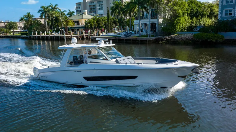 Slide: The Image of 2016 Boston Whaler 420 Outrage cruising on a scenic waterway. - 0