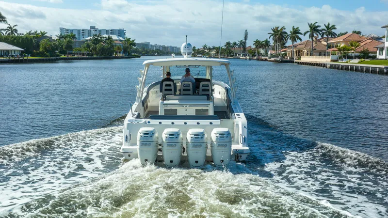 Slide: The Image of 2016 Boston Whaler 420 Outrage cruising on a scenic waterway. - 15