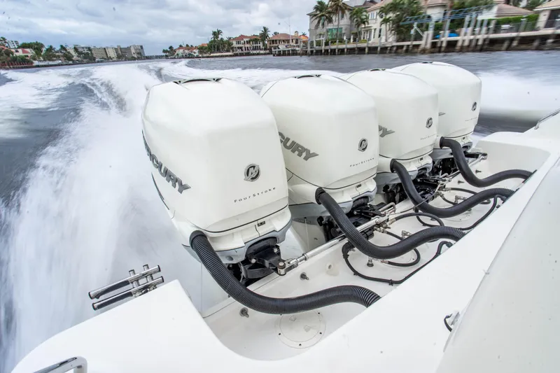 Slide: The Image of 2016 Boston Whaler 420 Outrage with four powerful Mercury outboard engines. - 17