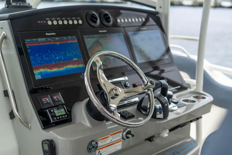 Slide: The Image of Control panel of 2016 Boston Whaler 420 Outrage with advanced navigation displays. - 21