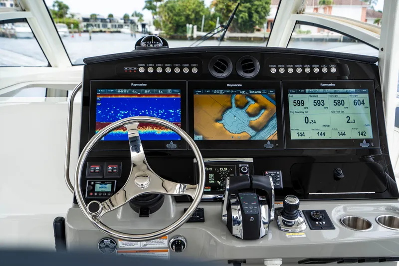 Slide: The Image of 2016 Boston Whaler 420 Outrage helm with advanced navigation displays and controls. - 22