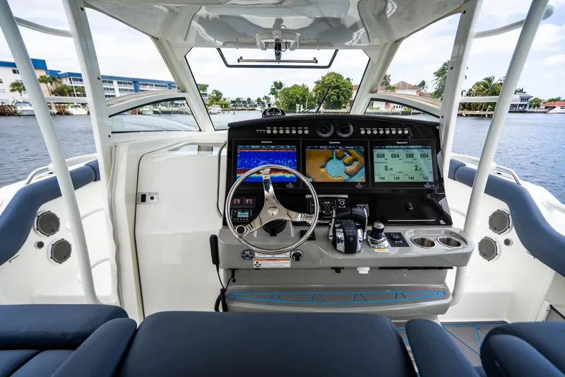 Slide: The Image of 2016 Boston Whaler 420 Outrage helm with advanced navigation system and controls. - 23