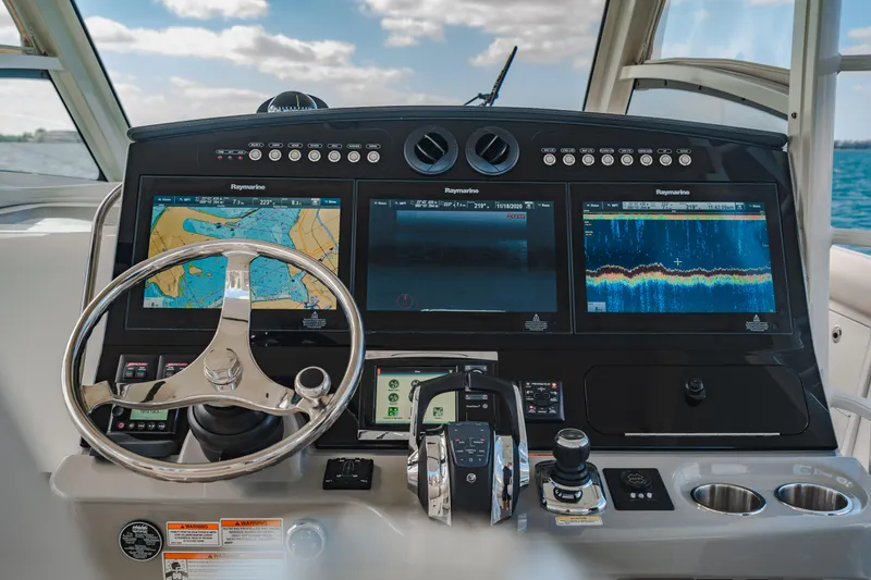 Slide: The Image of 2016 Boston Whaler 420 Outrage helm with advanced navigation displays and controls. - 24