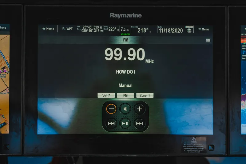 Slide: The Image of Raymarine display on 2016 Boston Whaler 420 Outrage showing FM radio frequency 99.90 MHz. - 29