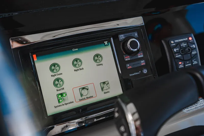 Slide: The Image of Control panel of 2016 Boston Whaler 420 Outrage boat with touchscreen interface. - 31