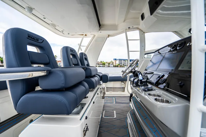 Slide: The Image of Interior of 2016 Boston Whaler 420 Outrage boat with modern helm and seating. - 35